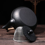 dos de théière en fonte avec filtre