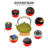 théière en fonte verte sur feux