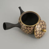 Théière Kyusu Kutani à fleurs de cerisier, couvercle posé à côté et intérieur ouvert
