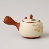 Théière Kyusu marron et blanche à fleurs de sakura, vue de côté avec l'anse latérale à gauche