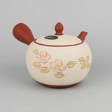 Théière Kyusu marron et blanche à fleurs de sakura, vue de face avec les fleurs et les feuilles peintes